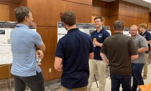 Poster Session:  Group shots of JANUS members viewing posters