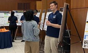 Poster Session:  Group shots of JANUS members viewing posters