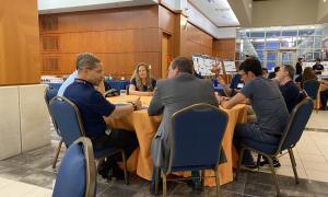 Poster Session:  Group shots of JANUS members viewing posters
